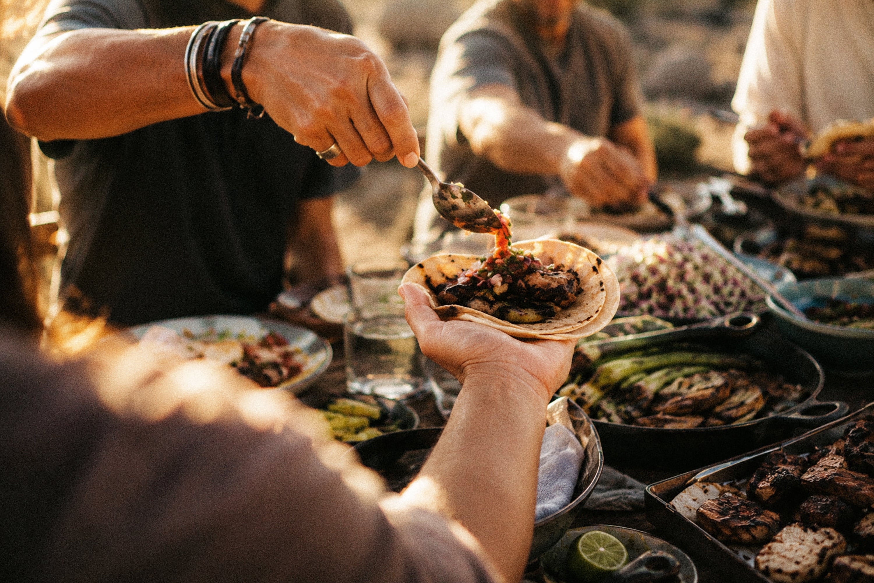 Preparing tacos for a shared meal